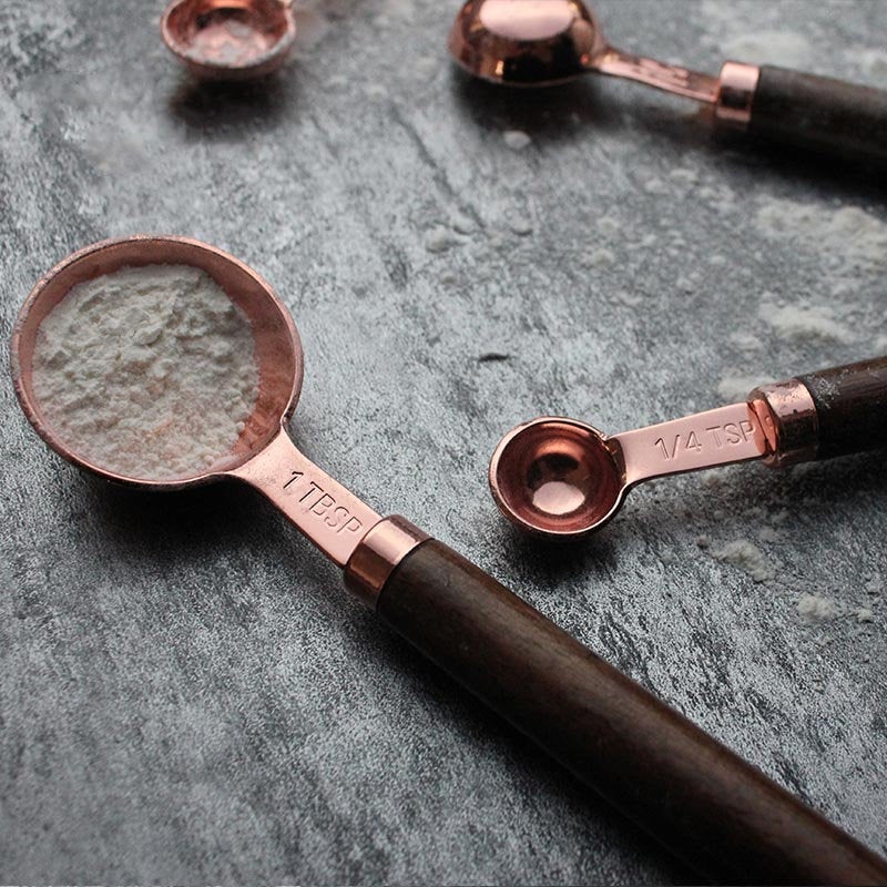 Set of Four Copper Measuring Spoons with Wooden Handles